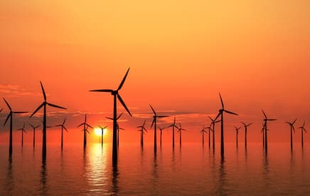 A wind farm at sunset is quite inspiring
